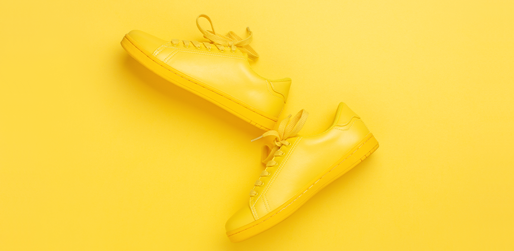 Yellow shoes on a yellow background