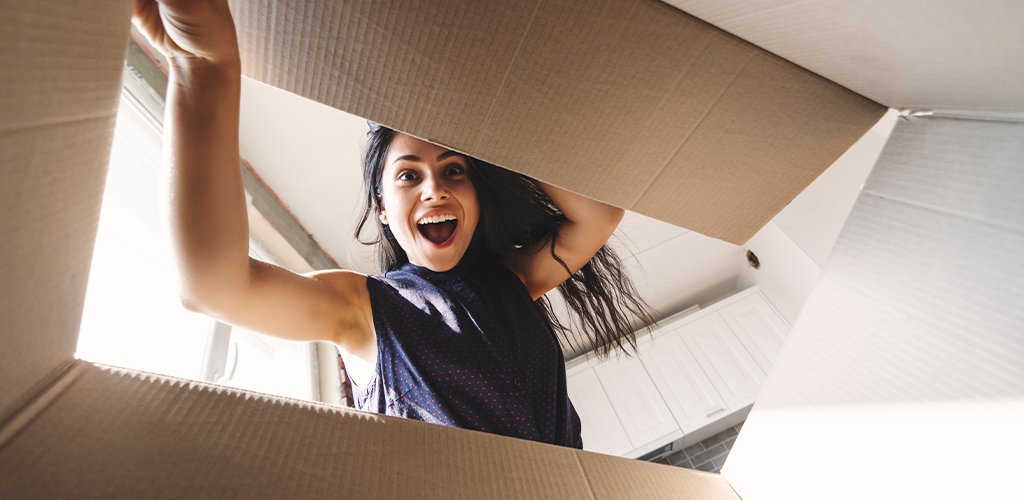 Woman opening a subscription box