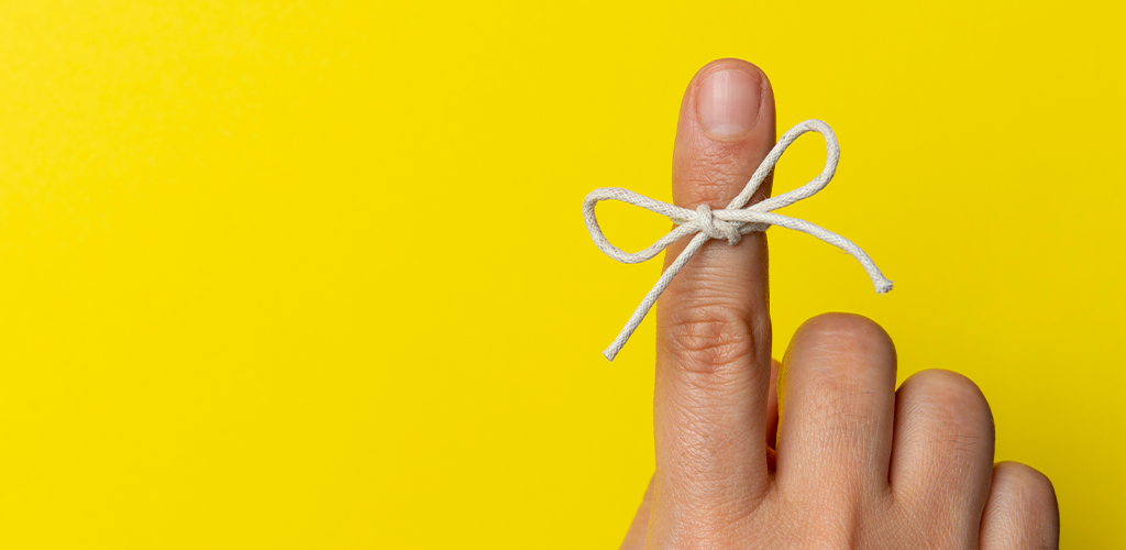 Memorable string tied around finger