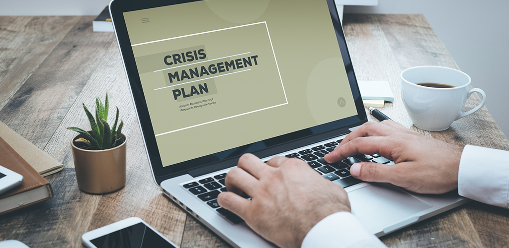 Crisis management plan on a laptop