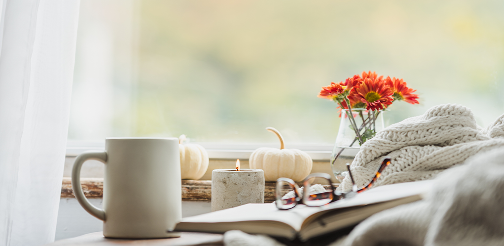 Relaxing set up with books, tea, and flowers to cut some slack