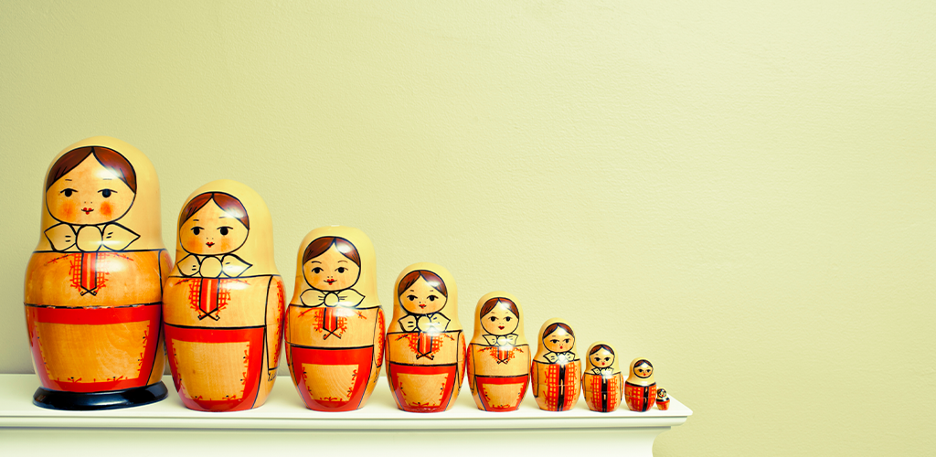 Nesting dolls getting smaller and smaller to represent compression of images