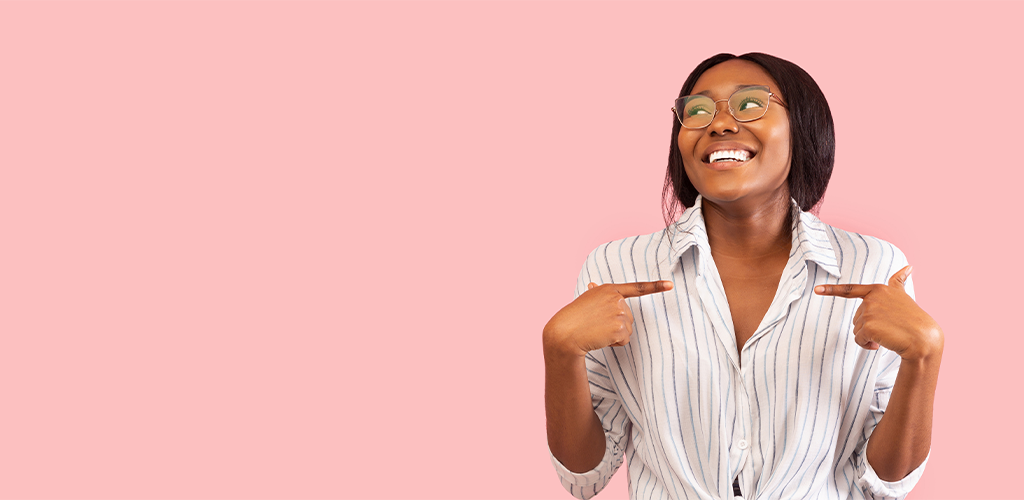 Woman presenter with a big personality pointing at herself